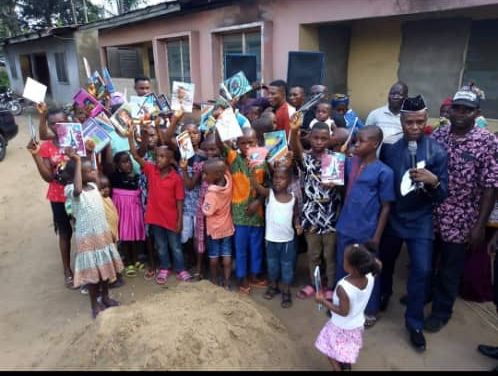 PRINCE USENOBONG JOSHUA FETES IKOT OBIO IKPA COMMUNITY…Doles out Wrappers to Women and Writing Materials to School Pupils…Lucy Akpan